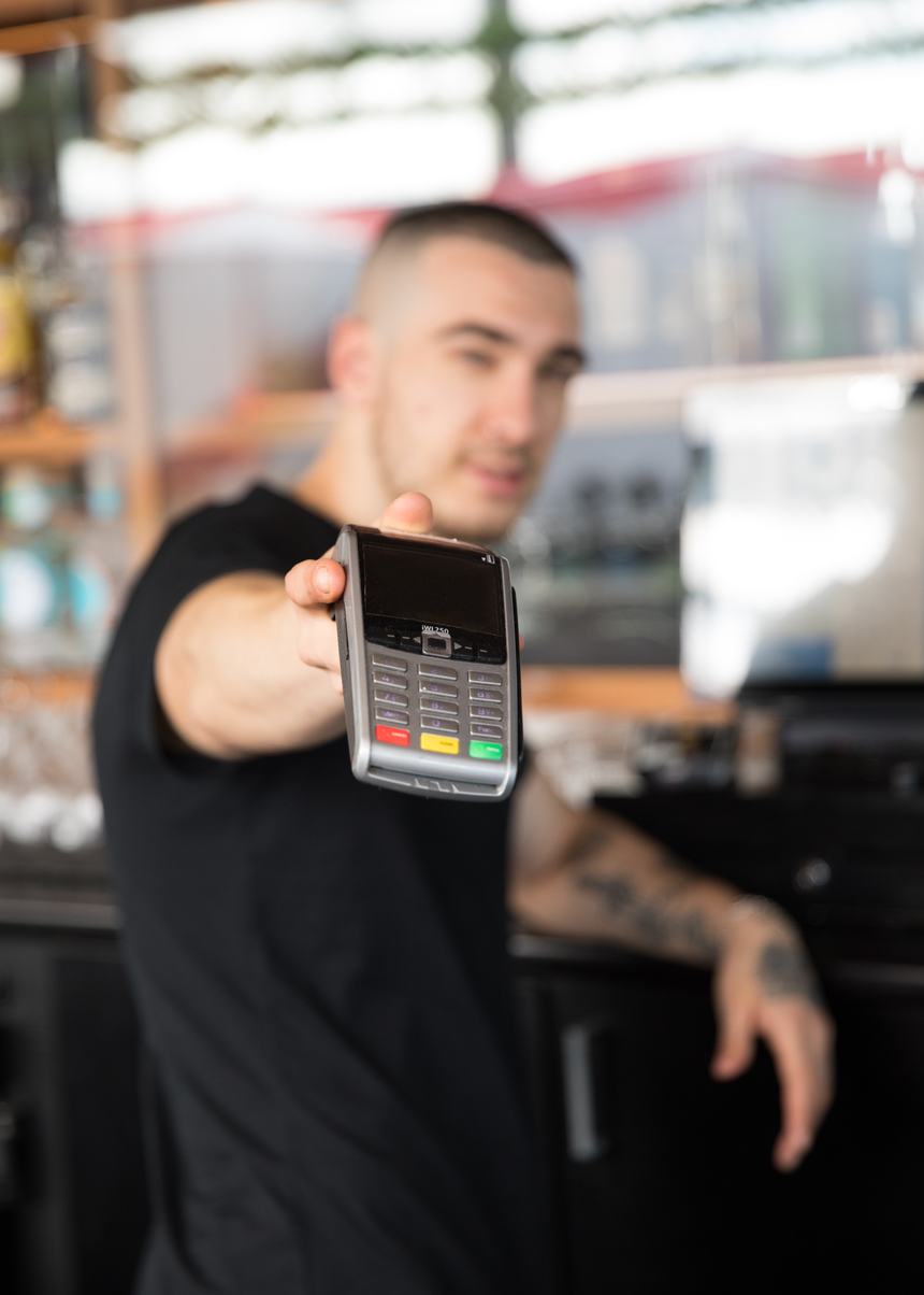 Hospitality worker at the till